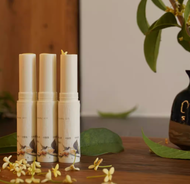 Three Joy Garden Osmanthus & Honey Lip Balms displayed together – showing size and packaging for food-grade natural moisturizer