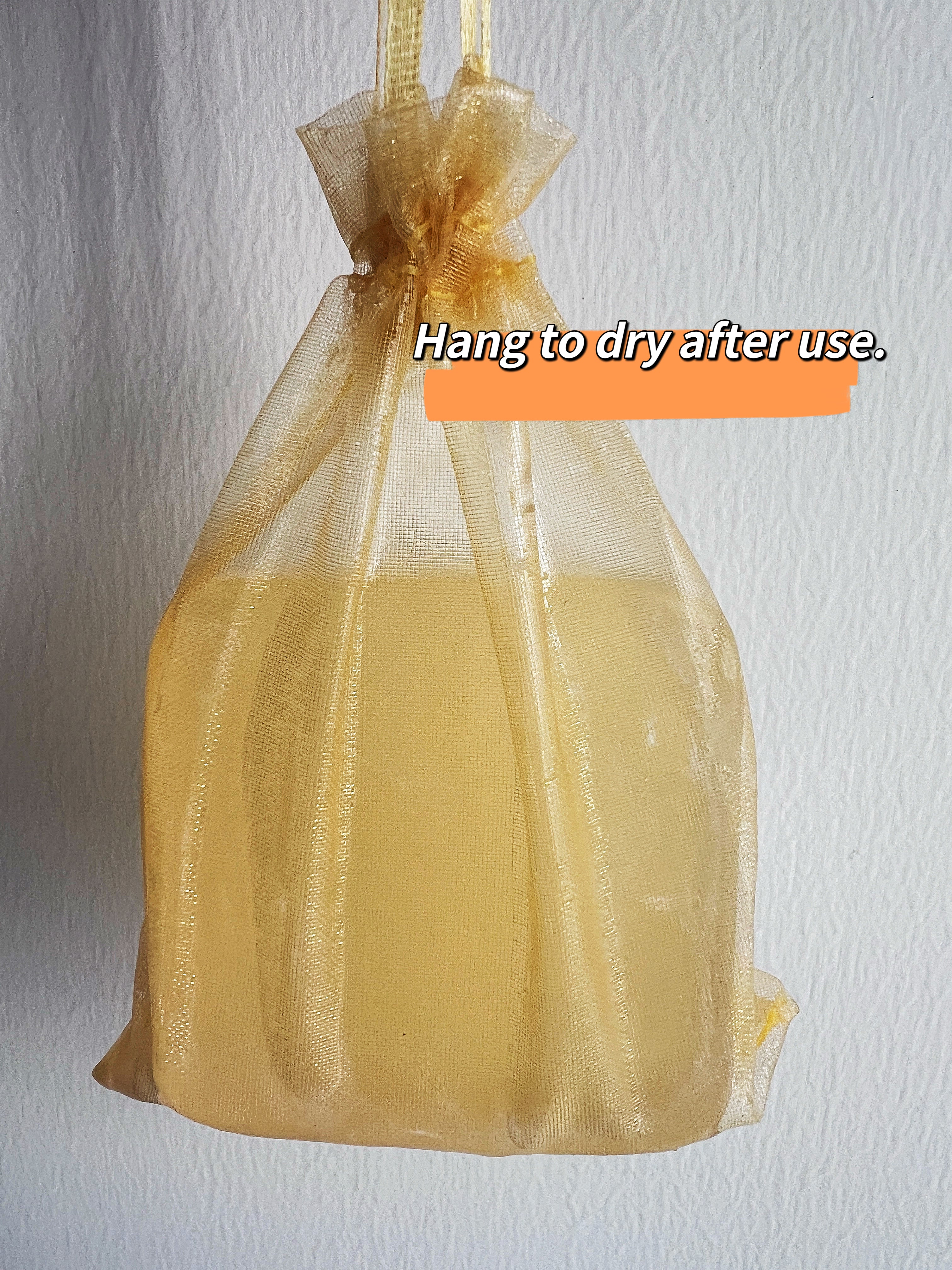 Joy Garden Hinoki Silk Protein Facial Soap hanging in net to air dry naturally