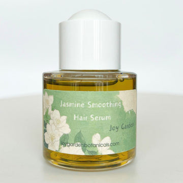 Joy Garden Jasmine Smoothing Hair Serum front bottle – ultra-lightweight botanical elixir for instant frizz control and mirror-like shine.