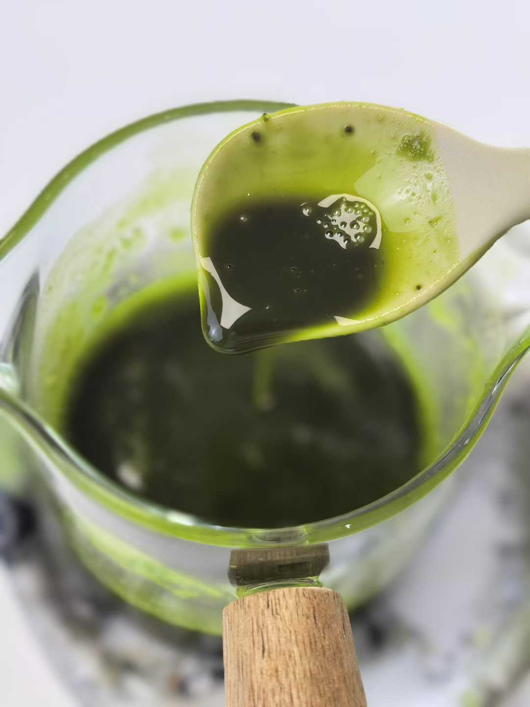 Liquid stage of Joy Garden Pure Matcha Lip Balm before solidifying – handcrafted natural lip balm mixture in preparation process