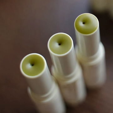 applying-vegan-matcha-lip-balm-on-lips.