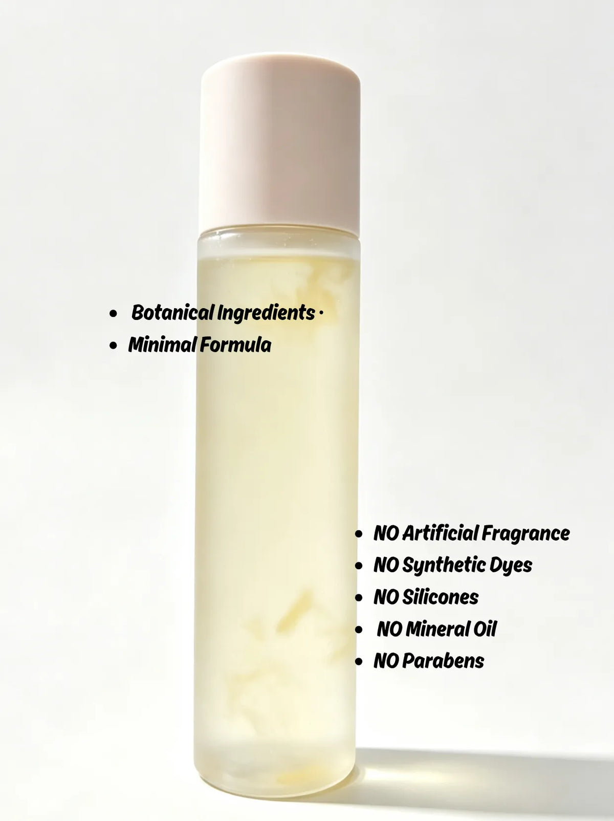 Joy Garden hydrating essence bottle highlighting clean formula free from artificial fragrances, dyes, silicones, and parabens
