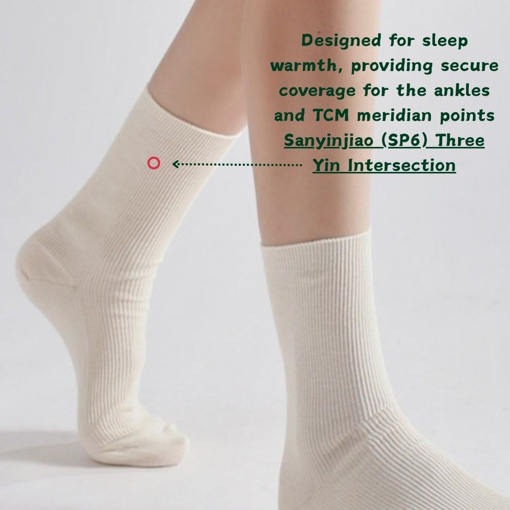 Model wearing Joy Garden organic cotton socks covering the Sanyinjiao point and ankles for warmth and wellness.
