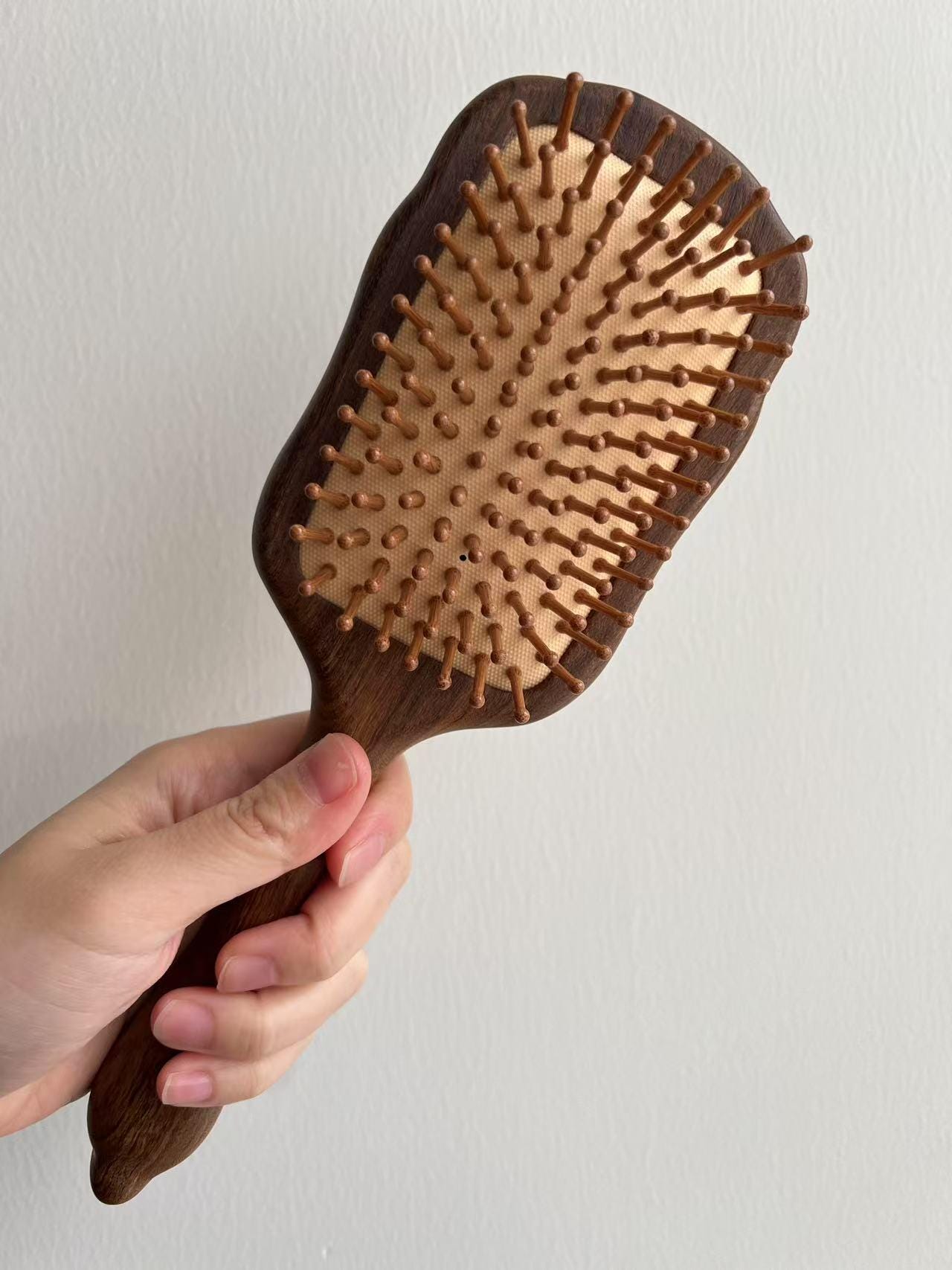 Wooden hair brush with wooden bristles, dark walnut handle and golden rosewood body, large cushion paddle design for gentle detangling and relaxing scalp meridian massage